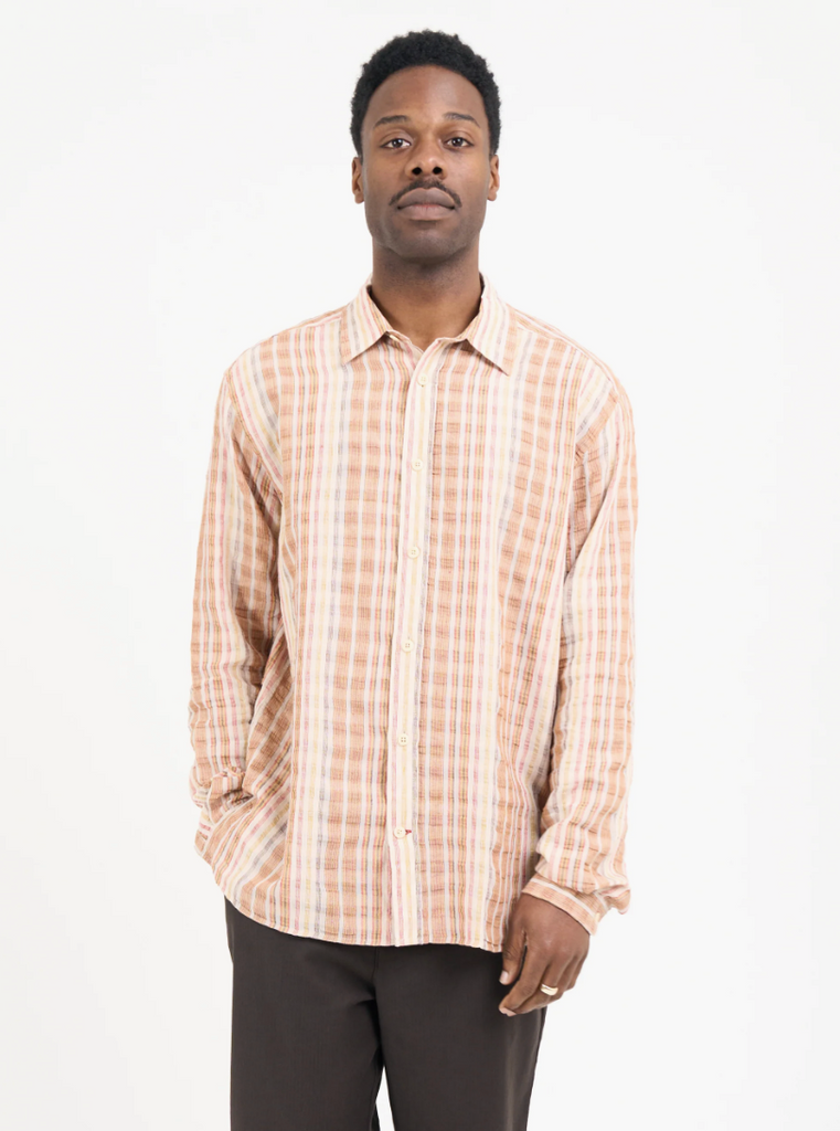 Multi-colored oversized long-sleeve shirt in lightweight cotton-linen seersucker, featuring a spear collar, front patch pocket, curved hem, and contrast gusset.