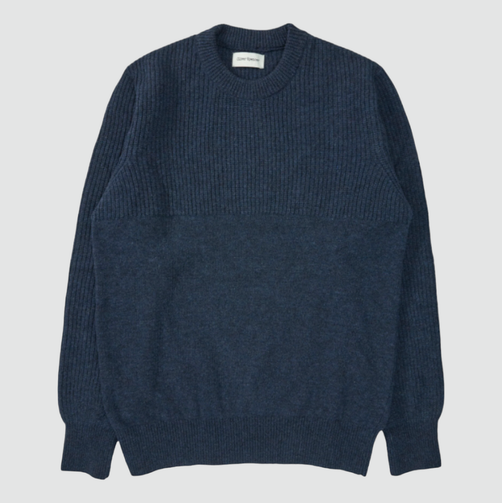 A navy jumper made from 100% extrafine wool with ribbed details, a chest pocket, and a regular fit, featuring a double-faced contrast neck-ringer.