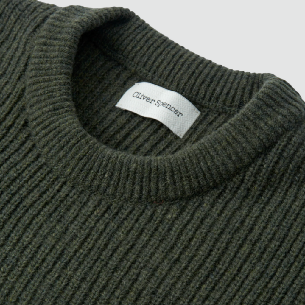 Green crew-neck jumper made from 100% extrafine wool with a chest pocket and double-faced contrast neck ringer. Regular fit with ribbed cuffs.