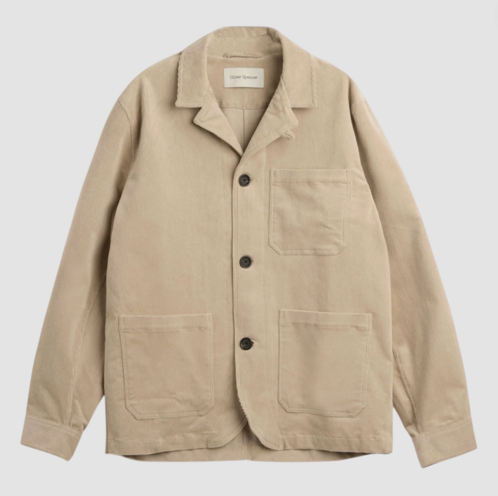 Beige corduroy jacket with button details on a light gray background.
