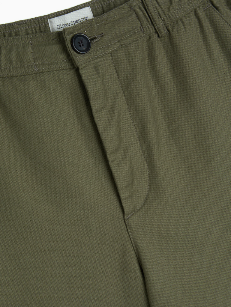 Green relaxed-fit drawstring trousers with a straight-leg cut, crafted from a midweight cotton-linen blend with a herringbone weave, featuring back pockets.