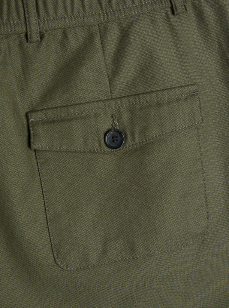 Green relaxed-fit drawstring trousers with a straight-leg cut, crafted from a midweight cotton-linen blend with a herringbone weave, featuring back pockets.