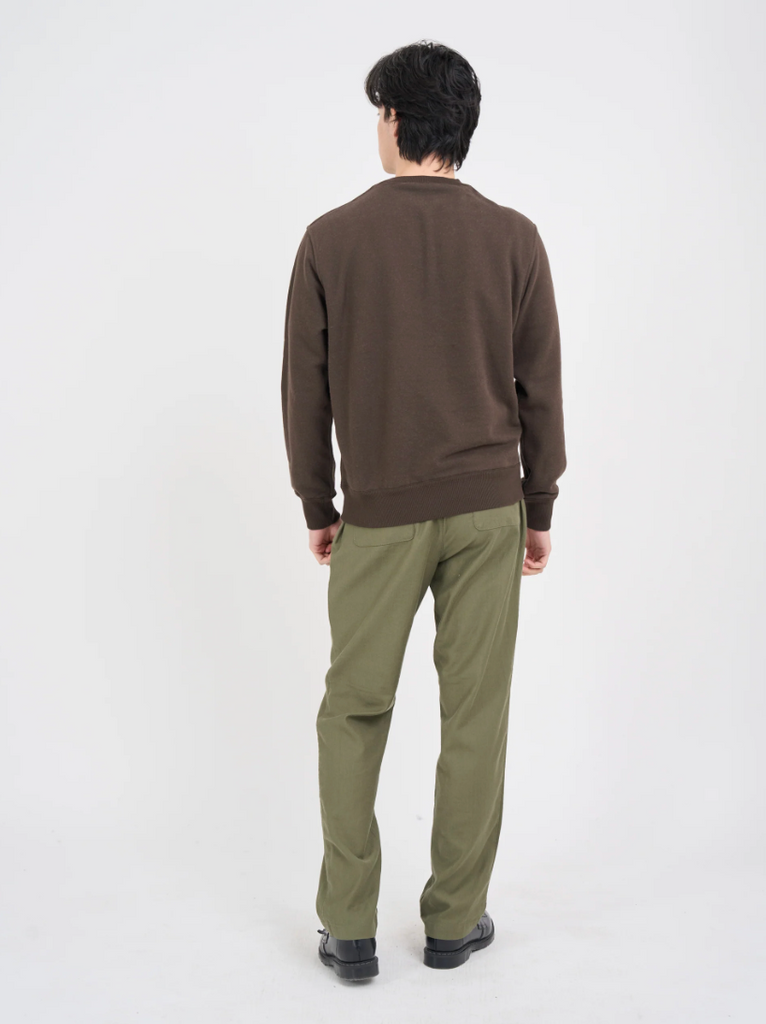 Green relaxed-fit drawstring trousers with a straight-leg cut, crafted from a midweight cotton-linen blend with a herringbone weave, featuring back pockets.