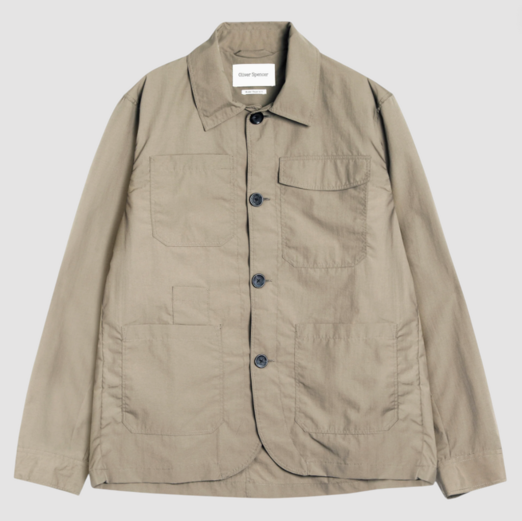 Khaki regular-fit chore jacket made from lightweight, water-repellent recycled polyamide, featuring multiple patch pockets and horn button closures.