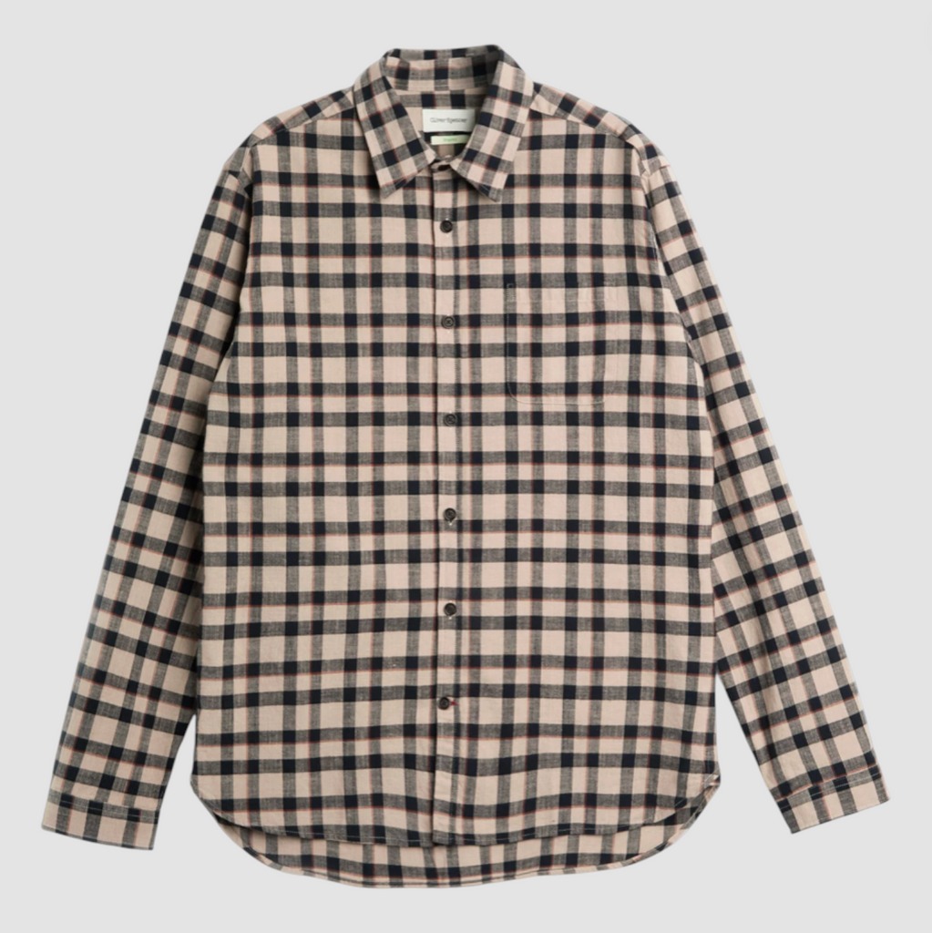 Plaid shirt with beige and black pattern on a light gray background.
