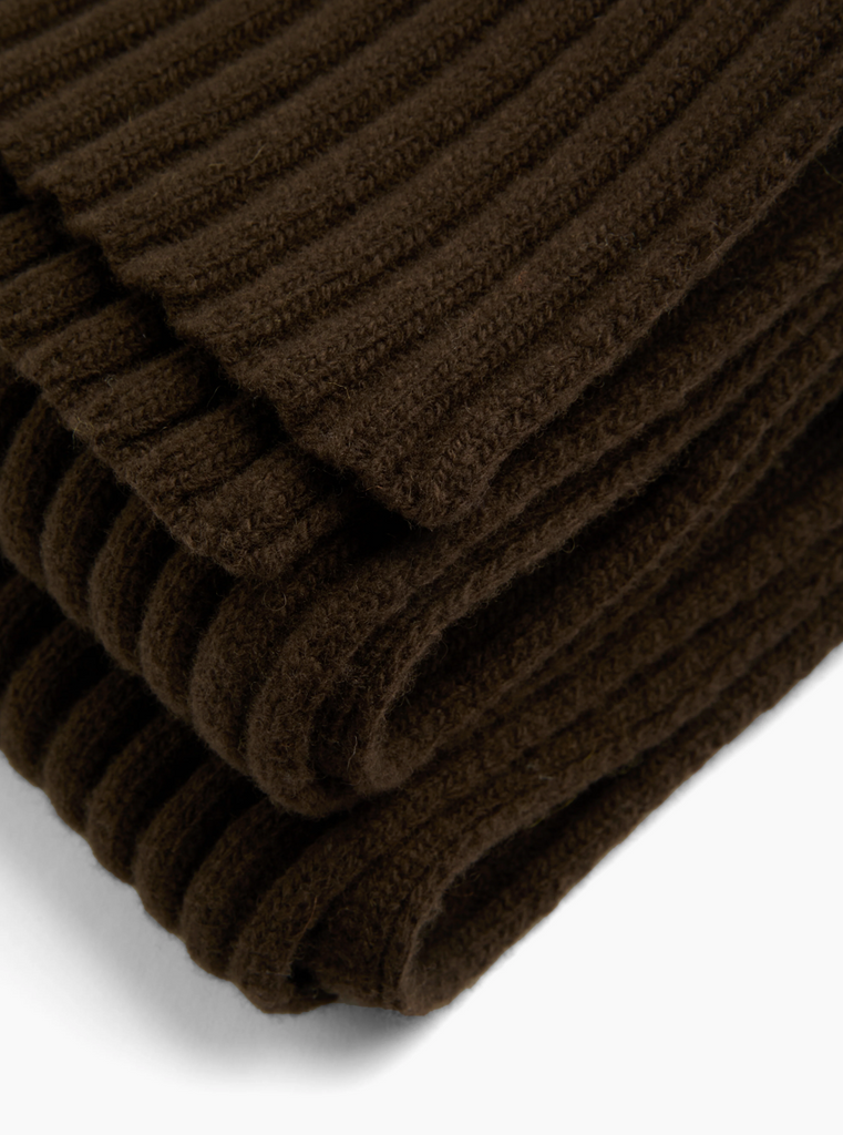 Brown ribbed scarf on a white background.