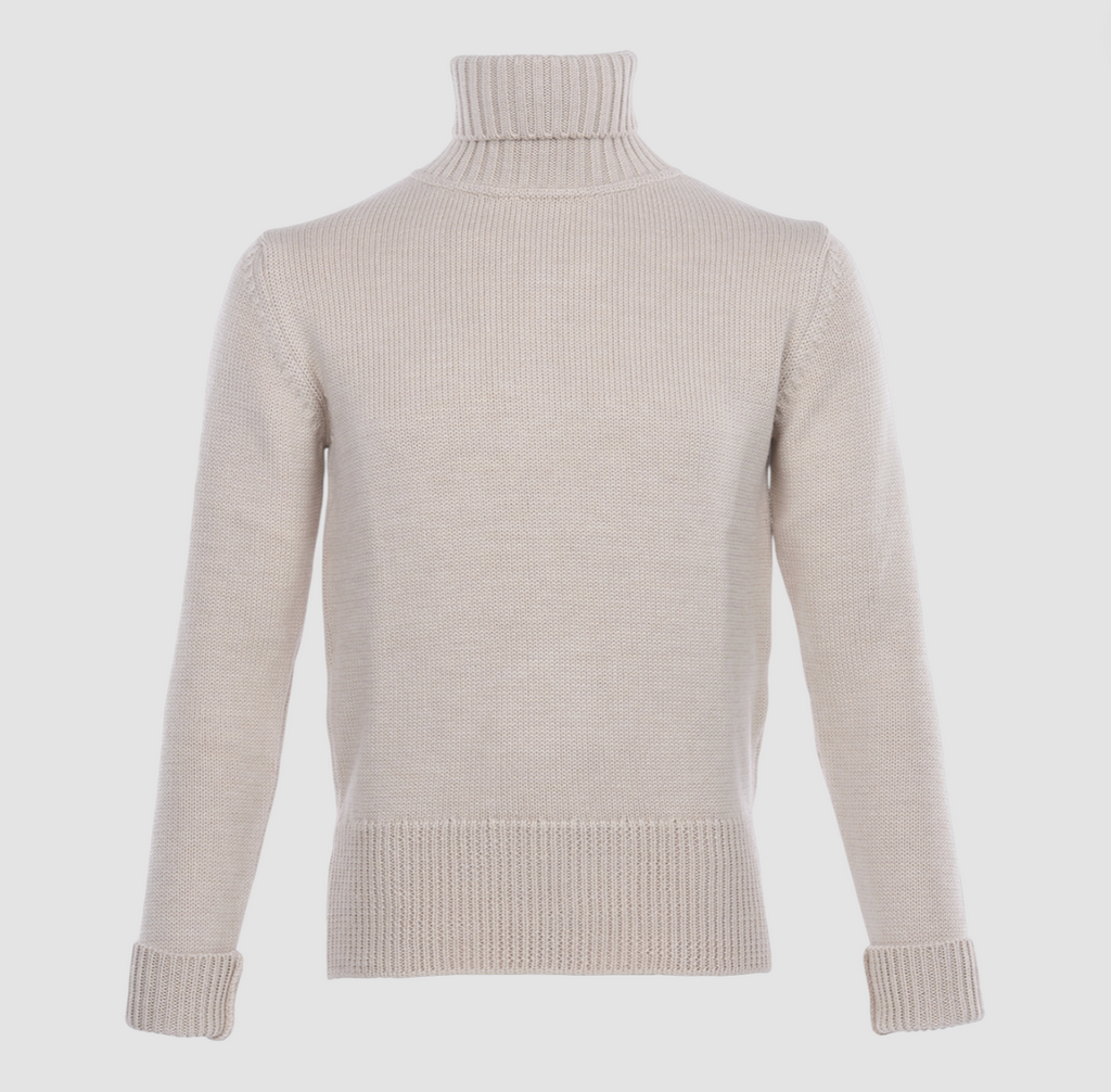 Ecru knitted roll-neck long sleeve sweater on a light grey background. 