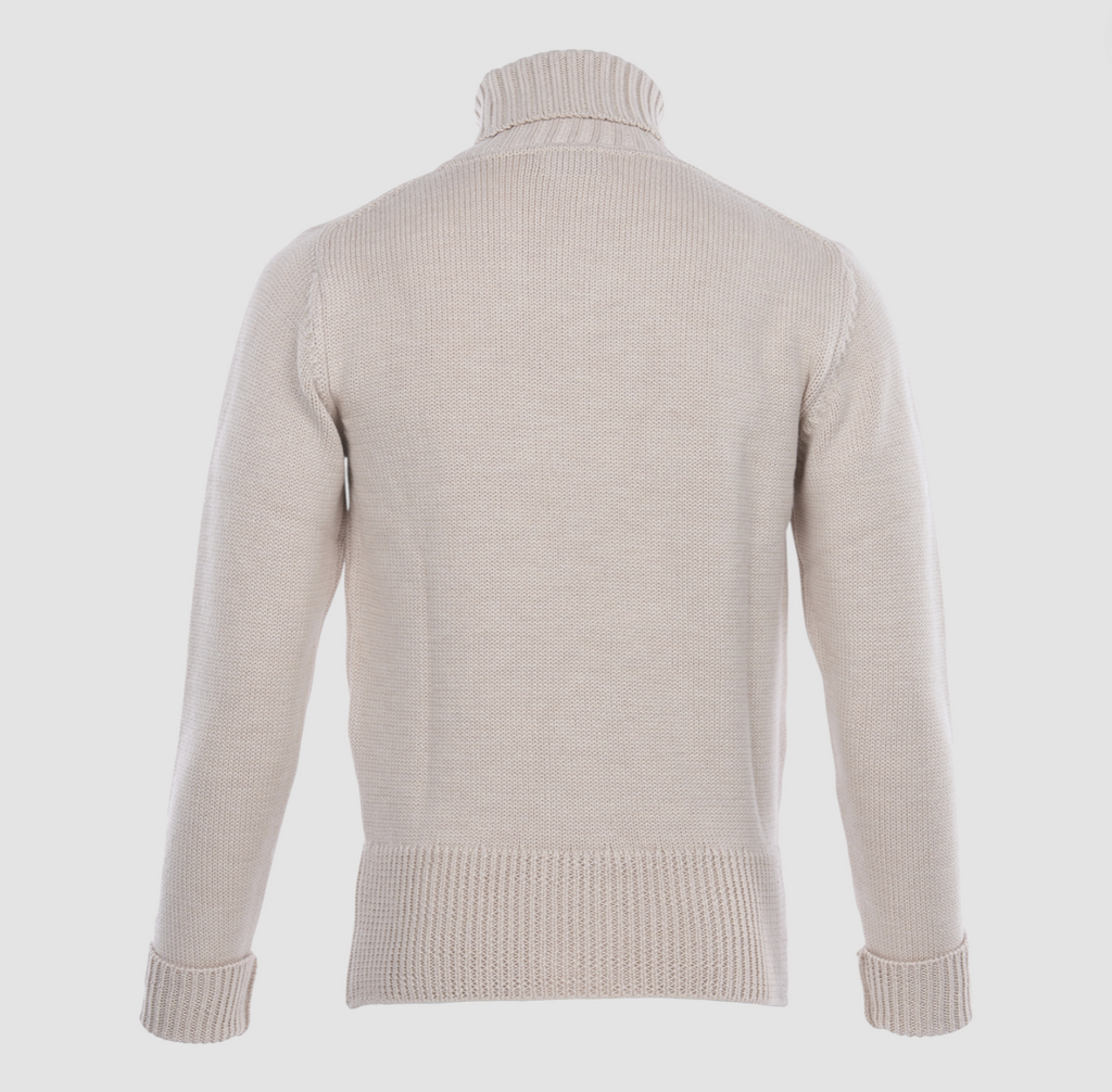 Ecru knitted roll-neck long sleeve sweater on a light grey background. 
