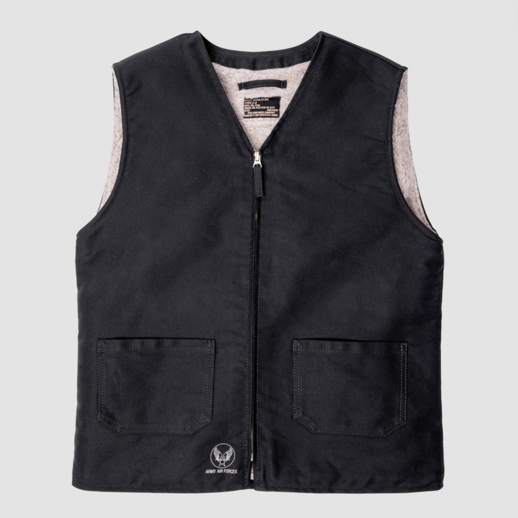 Navy vest with a brand logo on a light gray background.