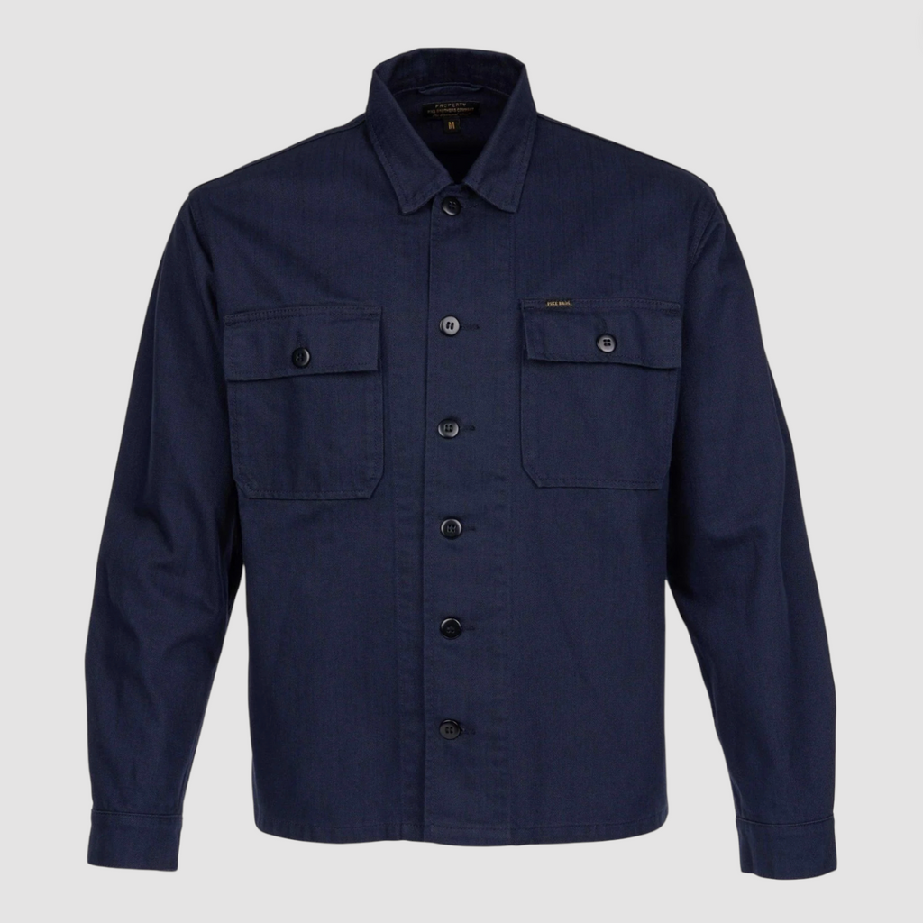Navy blue button-up shirt with two front pockets on a light gray background.