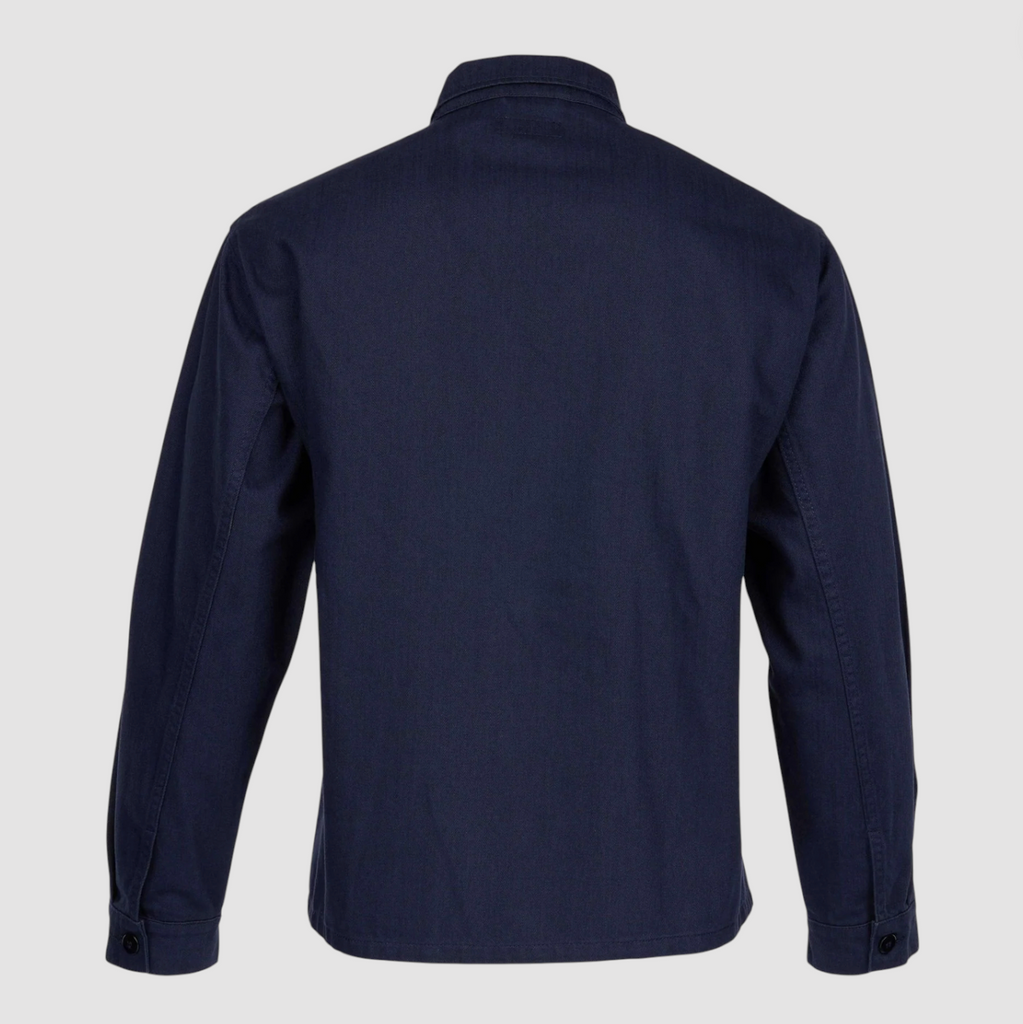 Navy blue shirt on a light gray background.
