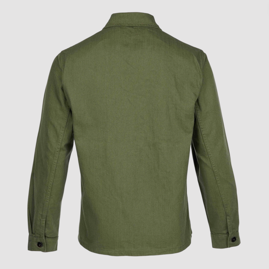 Green shirt on a light gray background.