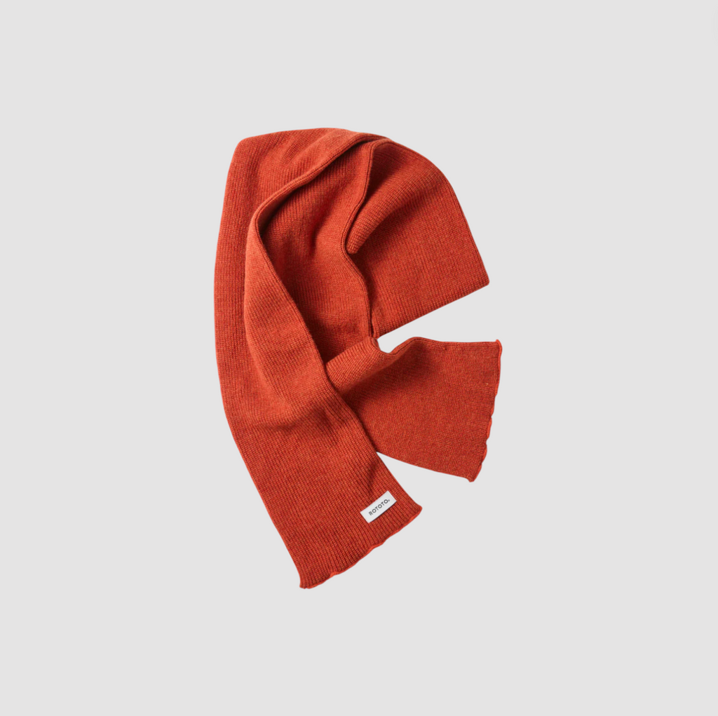 Orange scarf on a light gray background