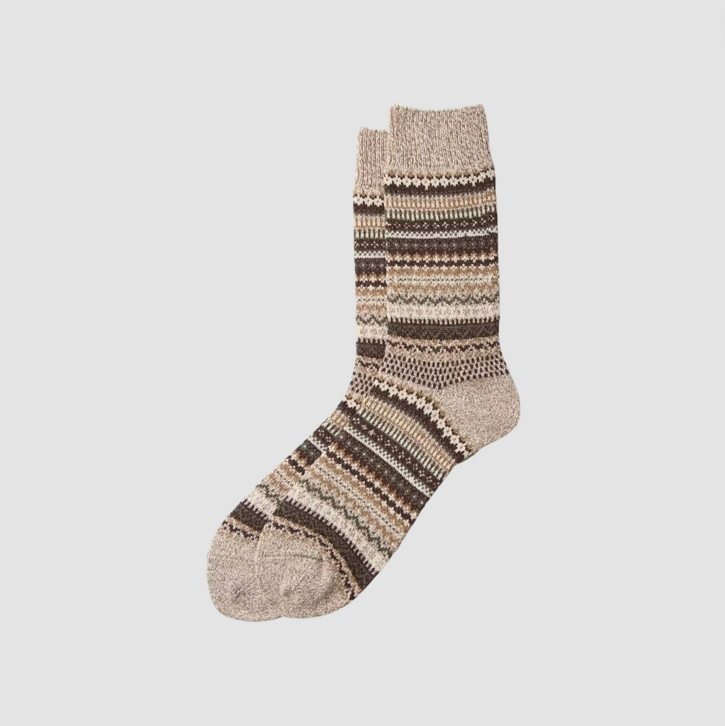 A pair of brown pattern socks on a light grey background. 