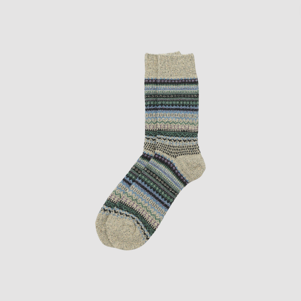 Knitted sock with multicolor pattern on a light gray background.