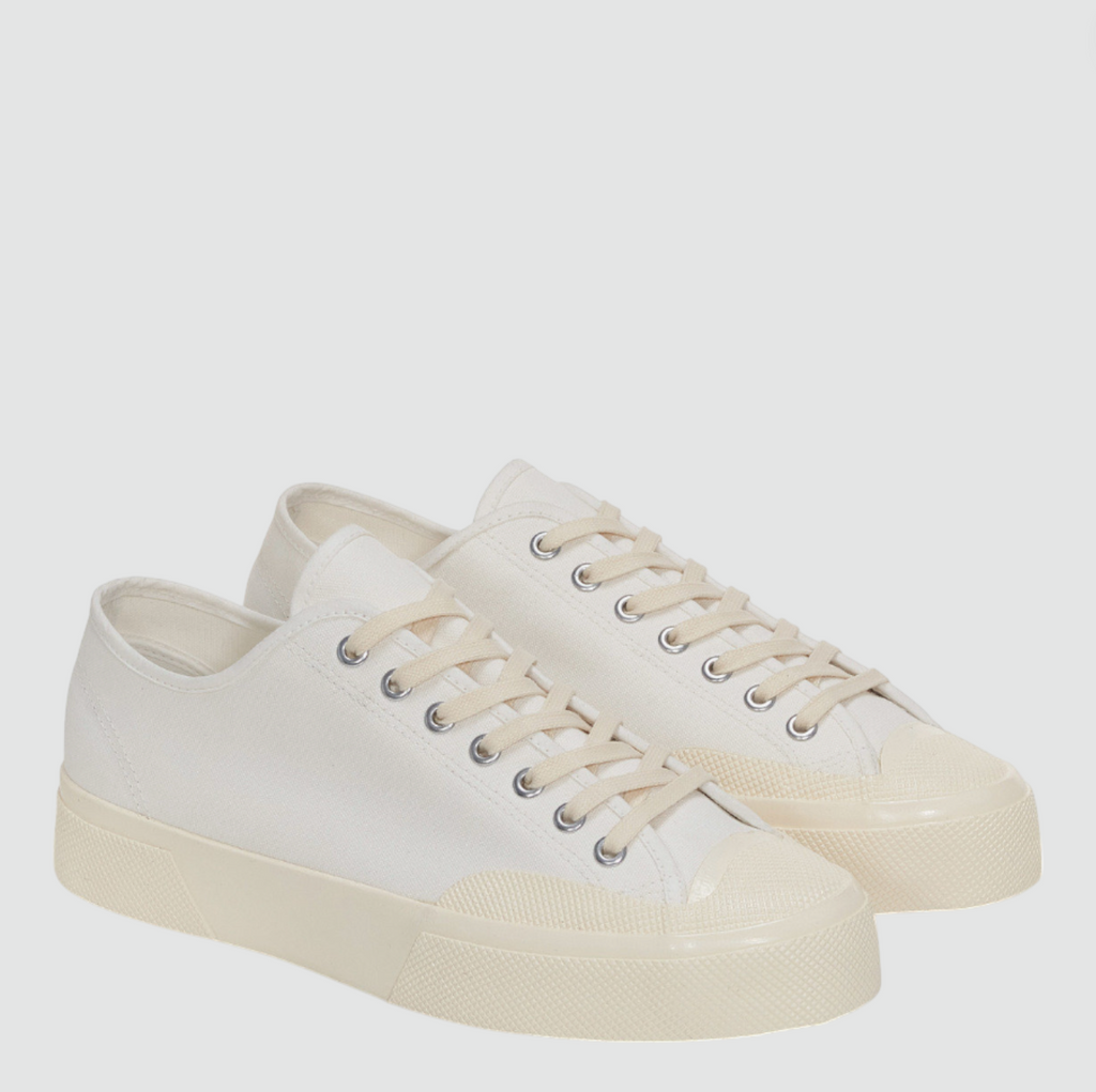 Retro-inspired low-top sneaker with cotton upper, rubber cupsole, and square toe design.