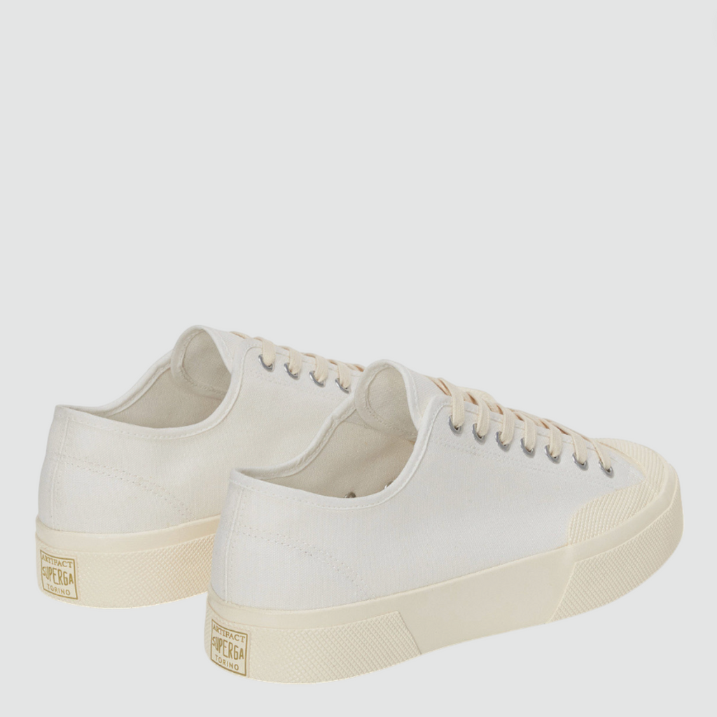 Retro-inspired low-top sneaker with cotton upper, rubber cupsole, and square toe design.