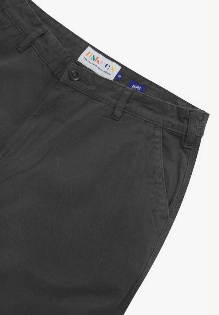 Dark gray pants with a brand label on a white background.