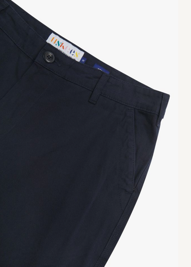 Navy pants with a brand label on a white background.