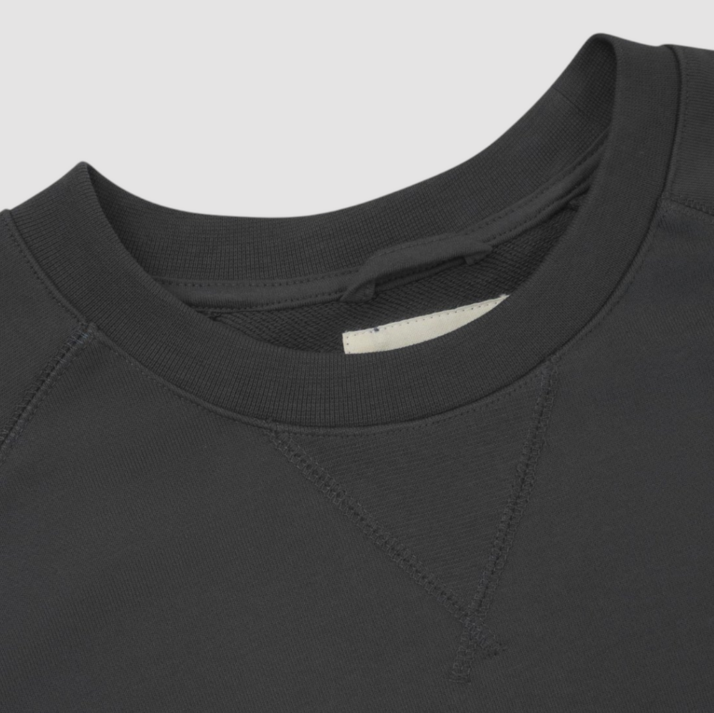 USKEES #7005 Sweatshirt in Faded Black, heavyweight 100% organic cotton, ribbed cuffs, raglan sleeves, crew neck, and decorative v-insert at neck.