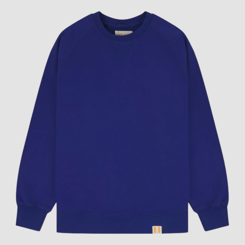 USKEES #7005 Ultra Blue Sweatshirt, enzyme-washed organic cotton, ribbed hem and cuffs, crew neck, raglan sleeves, and relaxed regular fit.