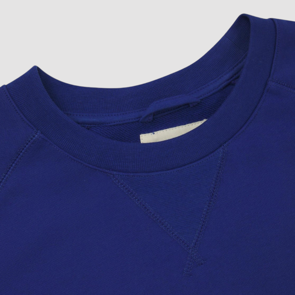 USKEES #7005 Ultra Blue Sweatshirt, enzyme-washed organic cotton, ribbed hem and cuffs, crew neck, raglan sleeves, and relaxed regular fit.