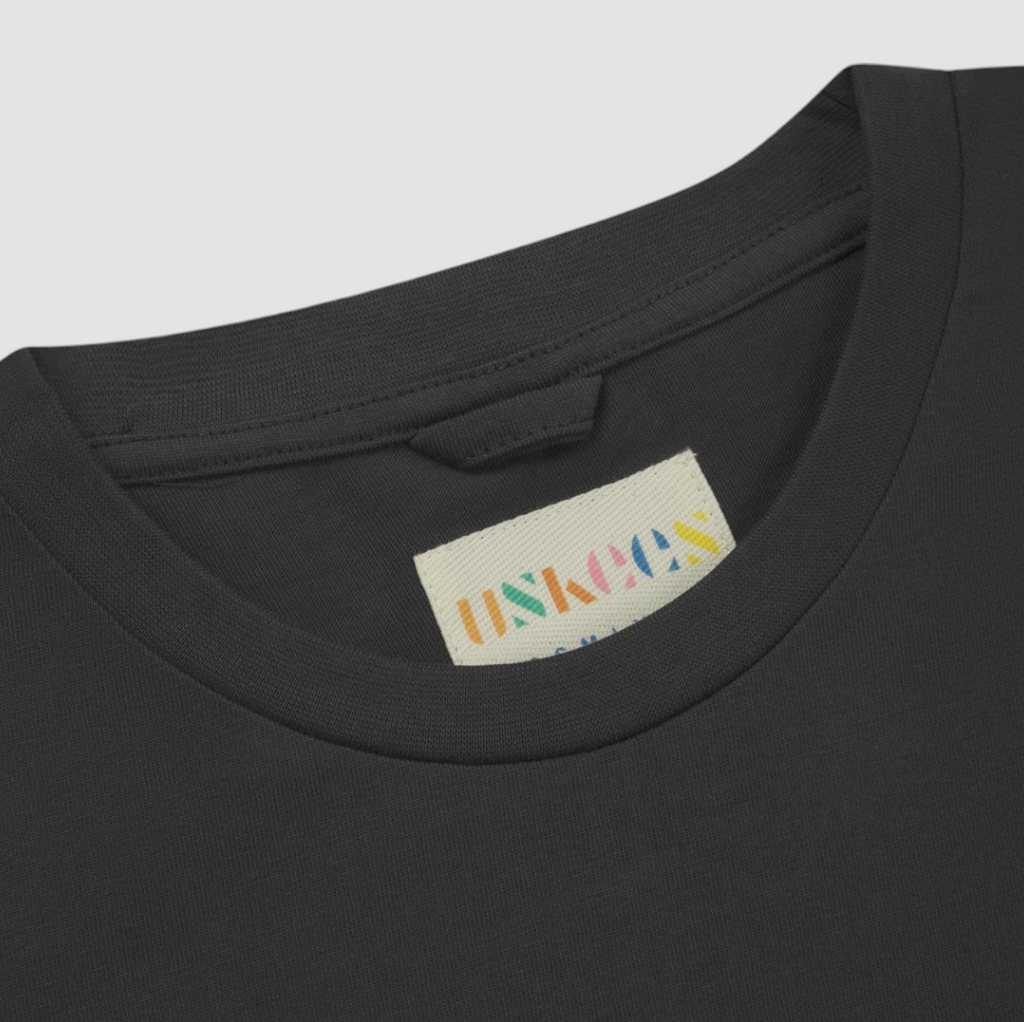 USKEES #7010 Long Sleeve T-Shirt in faded black, made from organic cotton, featuring a comfortable fit and subtle branding at the hem.