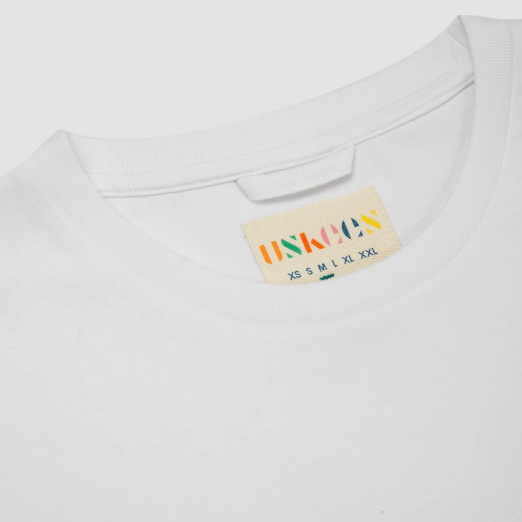 White USKEES #7010 Long Sleeve T-Shirt, enzyme-washed for a soft, lived-in feel, perfect for layering or casual wear.