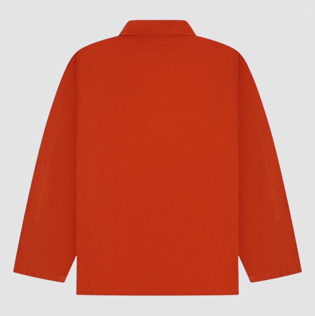 Back view of an orange jacket on a light gray background.