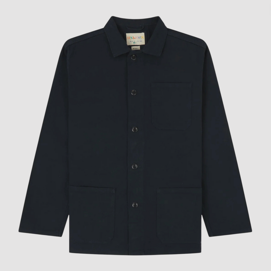 Navy overshirt with collar and buttons on a light gray background.