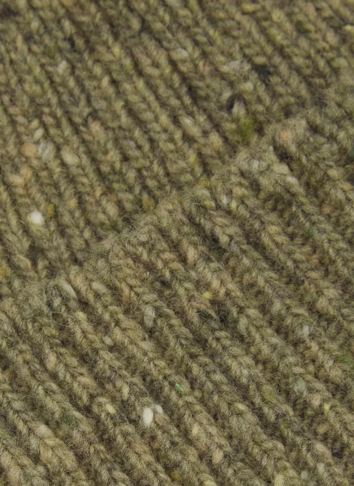 Close-up of a textured green fabric surface.