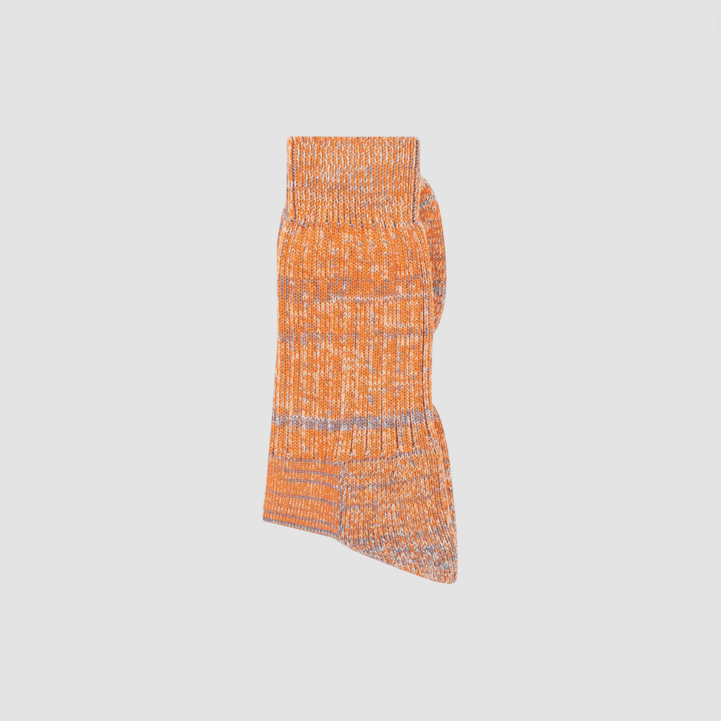 Orange and gray textured sock on a light gray background