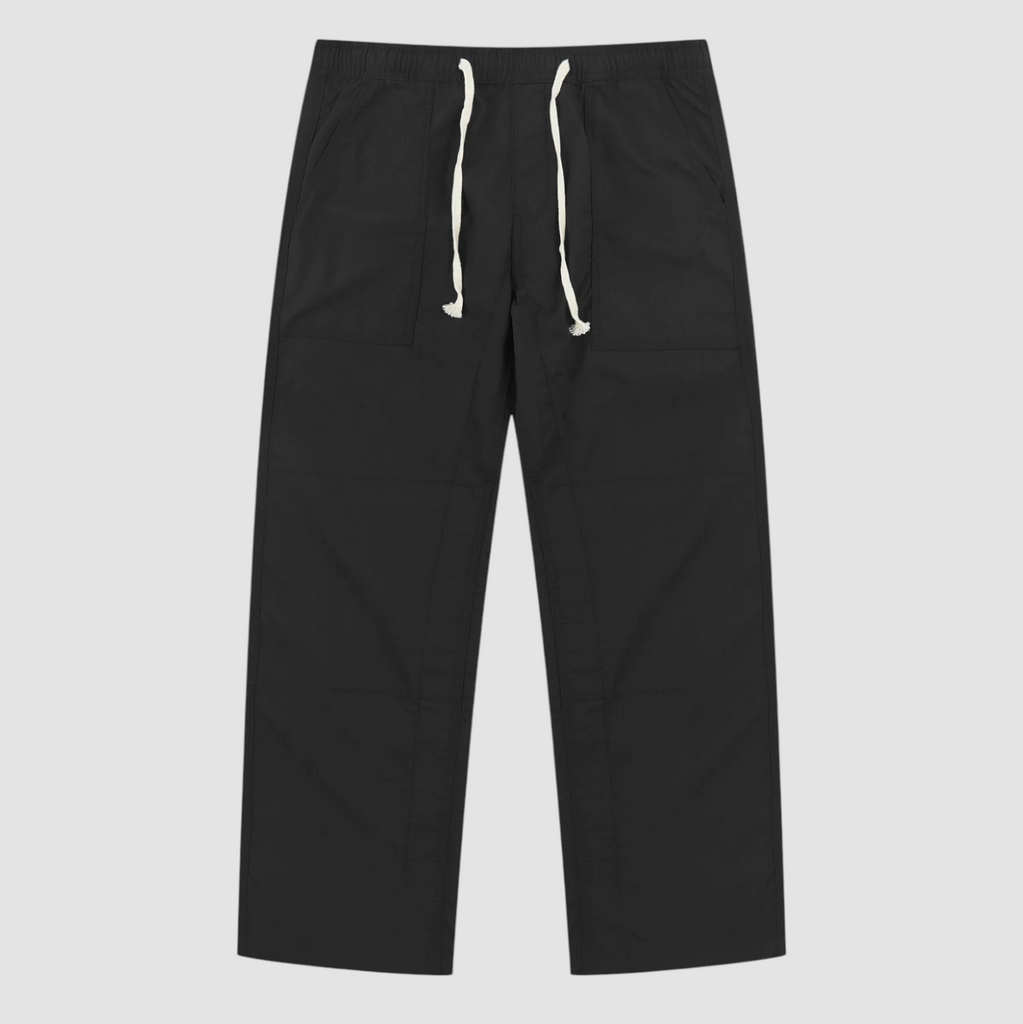 Black pants with white drawstring on a light gray background.