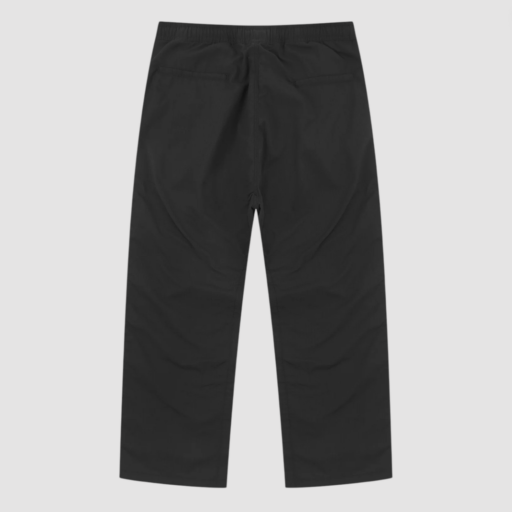Black pants on a light gray background.