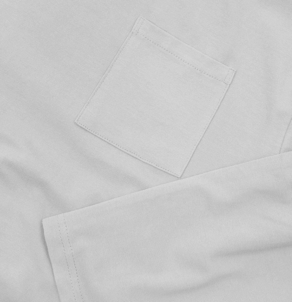 Close-up of a white fabric t-shirt with a pocket.