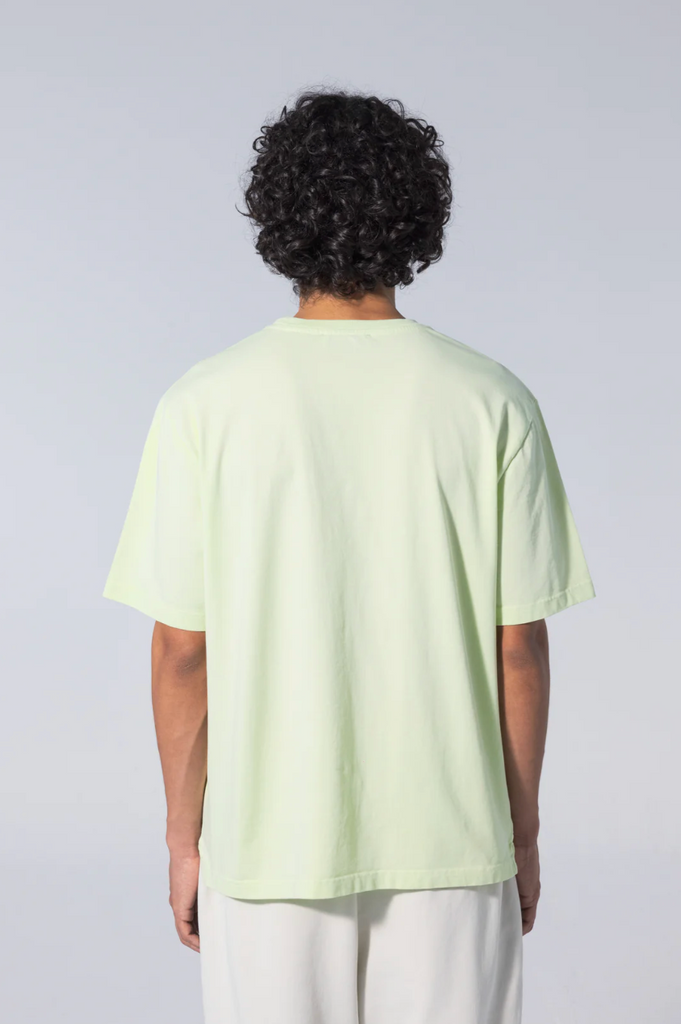 Unfeigned Basic T-Shirt in Cobalt Blue, featuring side slits and a longer back for a comfortable fit, made from breathable 100% organic cotton.