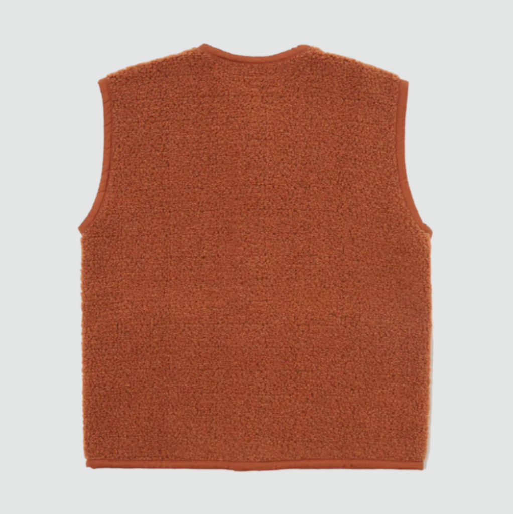 Universal Works Lancaster Gilet Alvar Fleece - Rust: Slim, snug fit with 5-button front, 2 patch pockets, jersey tonal binding. Made from recycled fibers (70% Polyester, 30% Wool)