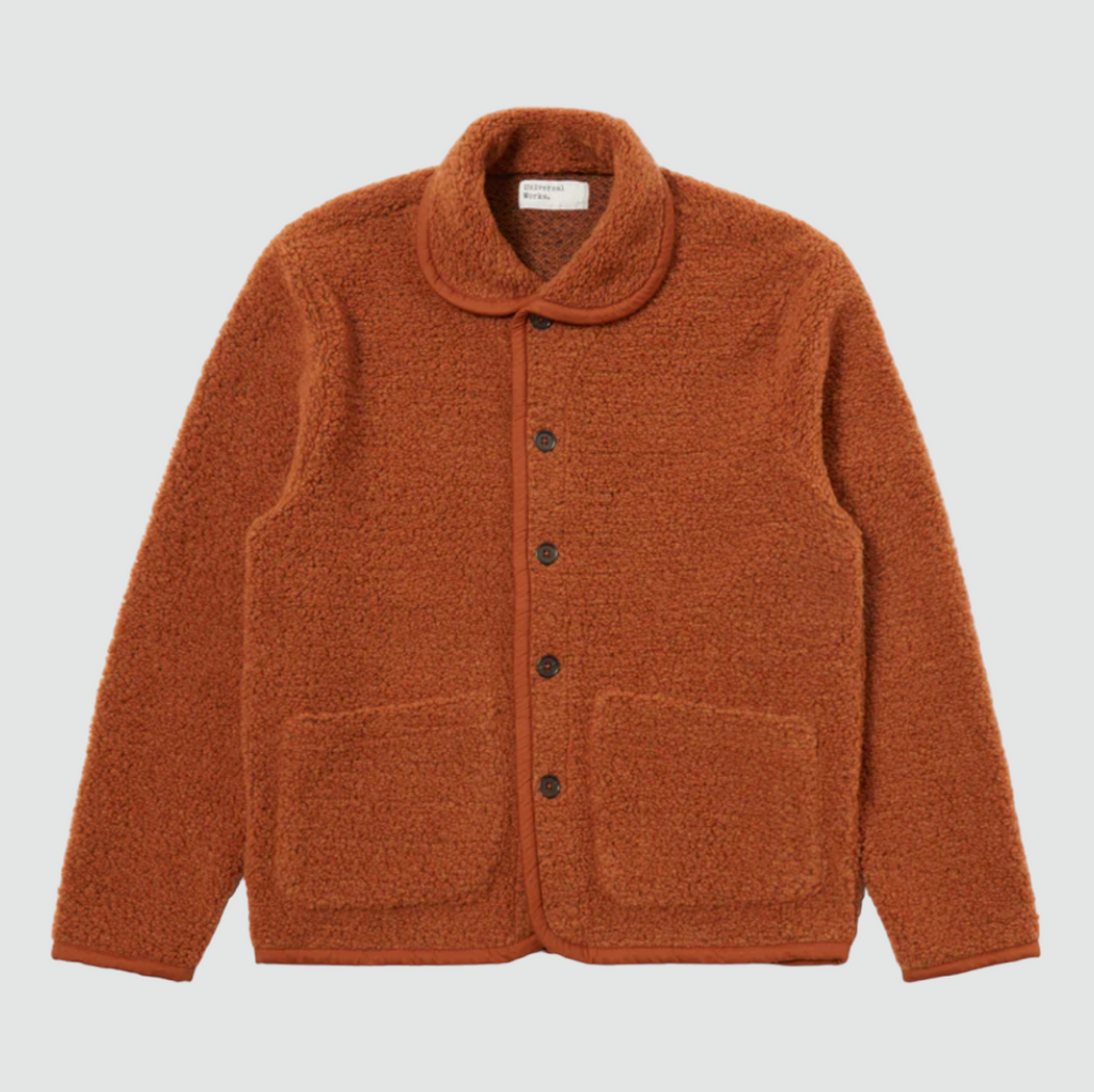 "Universal Works Lancaster Jacket Alvar Fleece - Rust: Regular fit fleece with shawl collar, five-button front, 2 patch pockets, jersey trim. Made from recycled fibers (70% Polyester, 30% Wool).