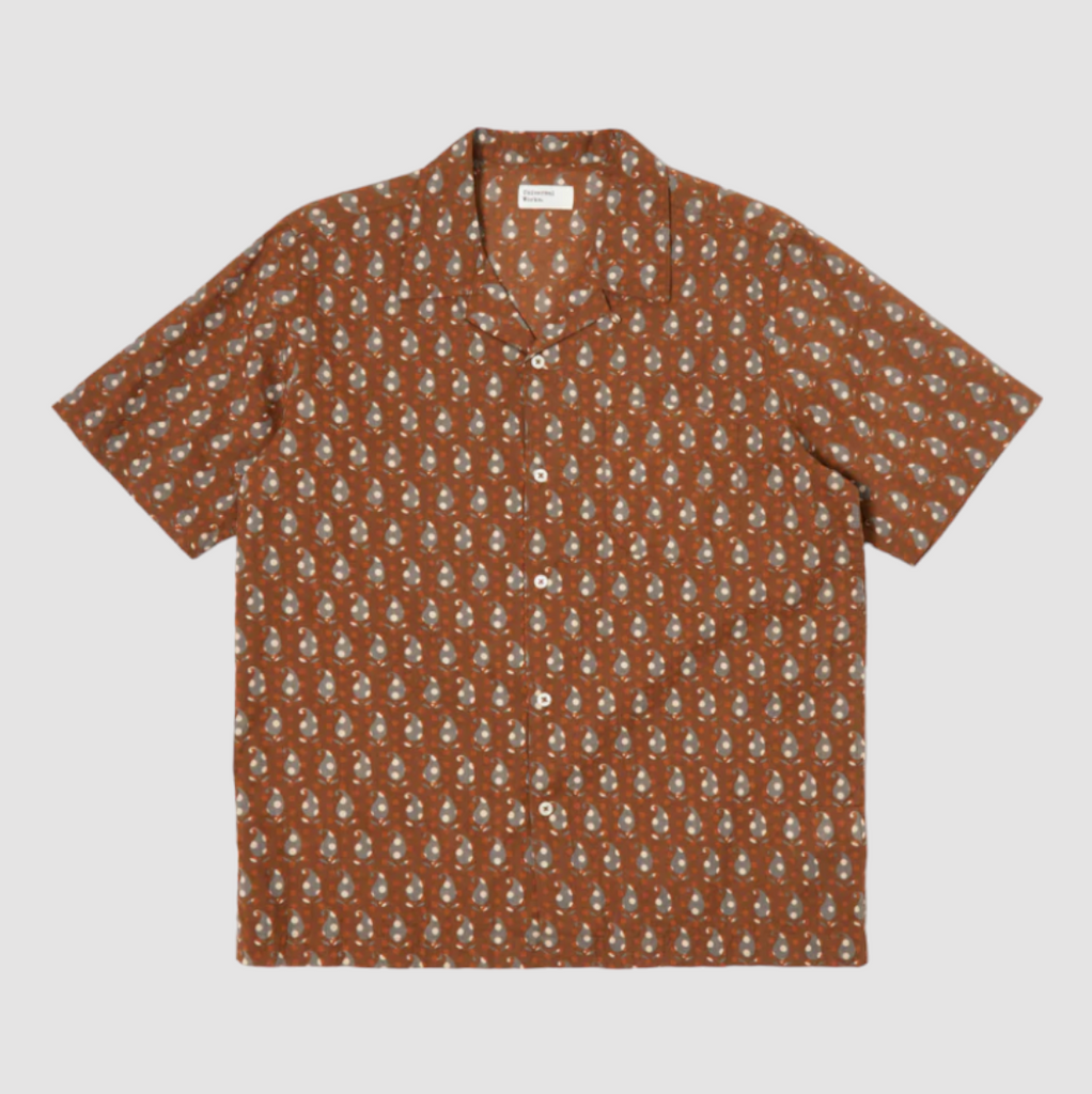 Universal Works Road Shirt in Brown Paisley Block Print: Classic short-sleeved summer shirt with relaxed fit, crafted from fine cambric cotton. Features intricate hand-blocked paisley design, perfect for casual or formal wear