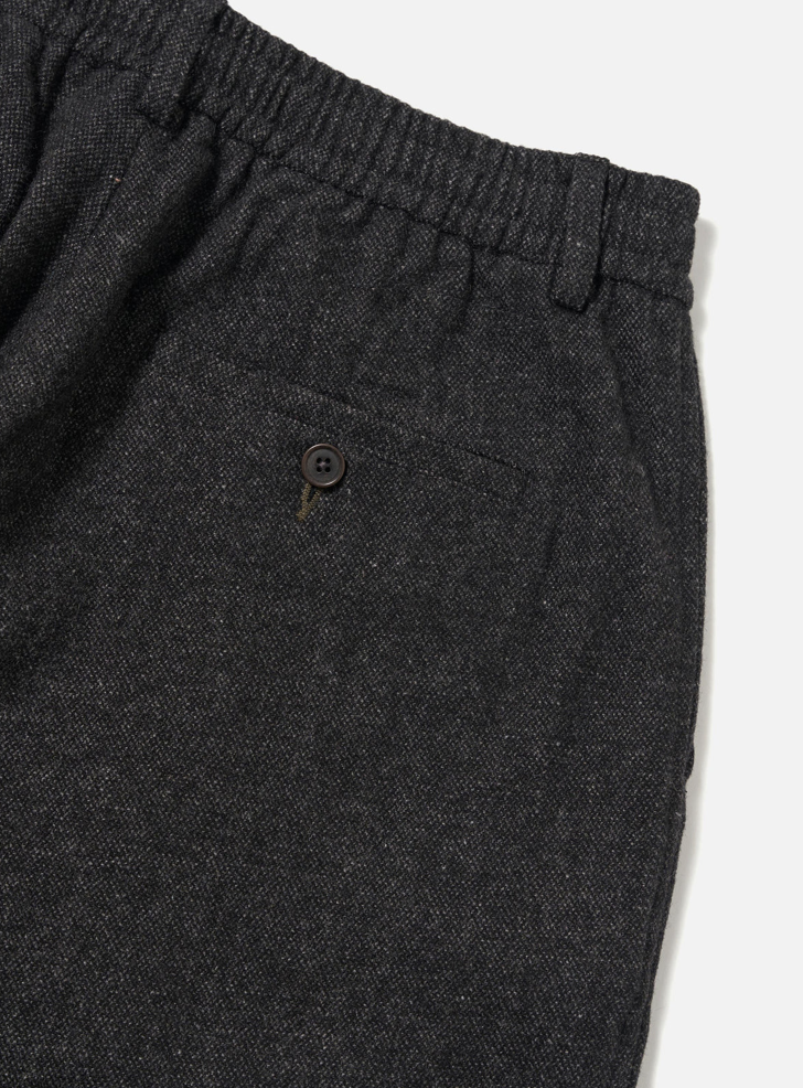 Dark gray pants with an elastic waistband on a white background.