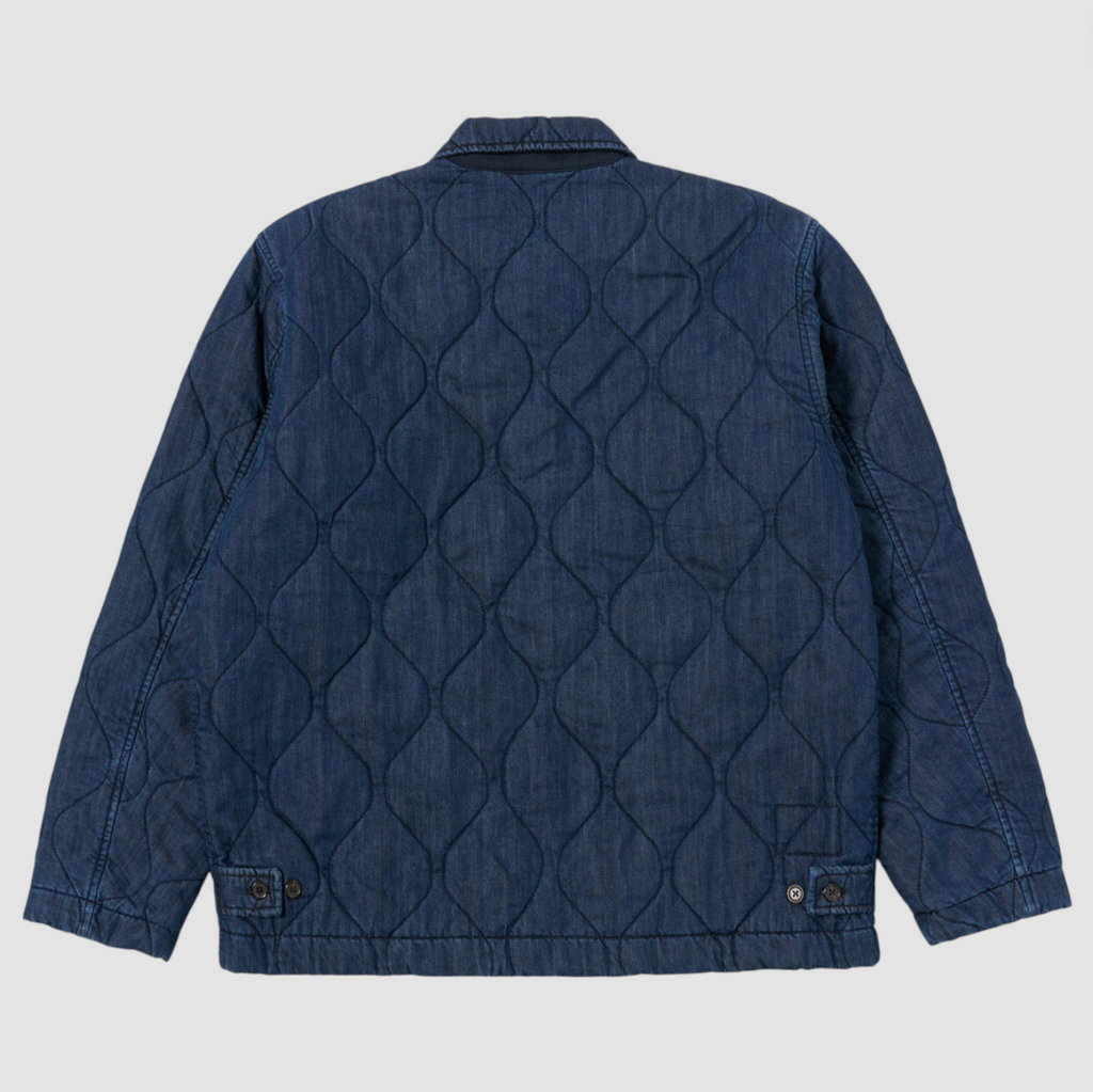 Quilted denim jacket on a light gray background