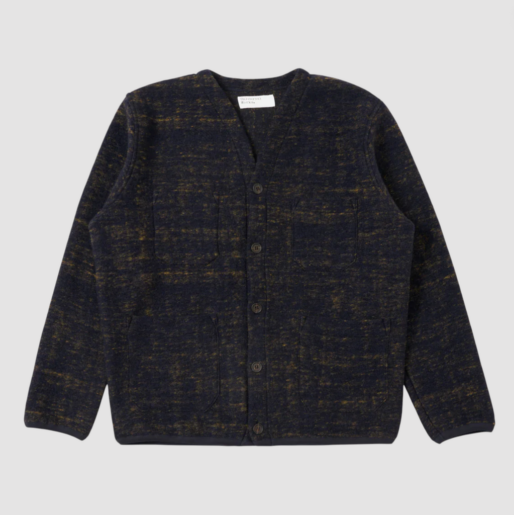 Navy patterned wool blend cardigan on a grey background.