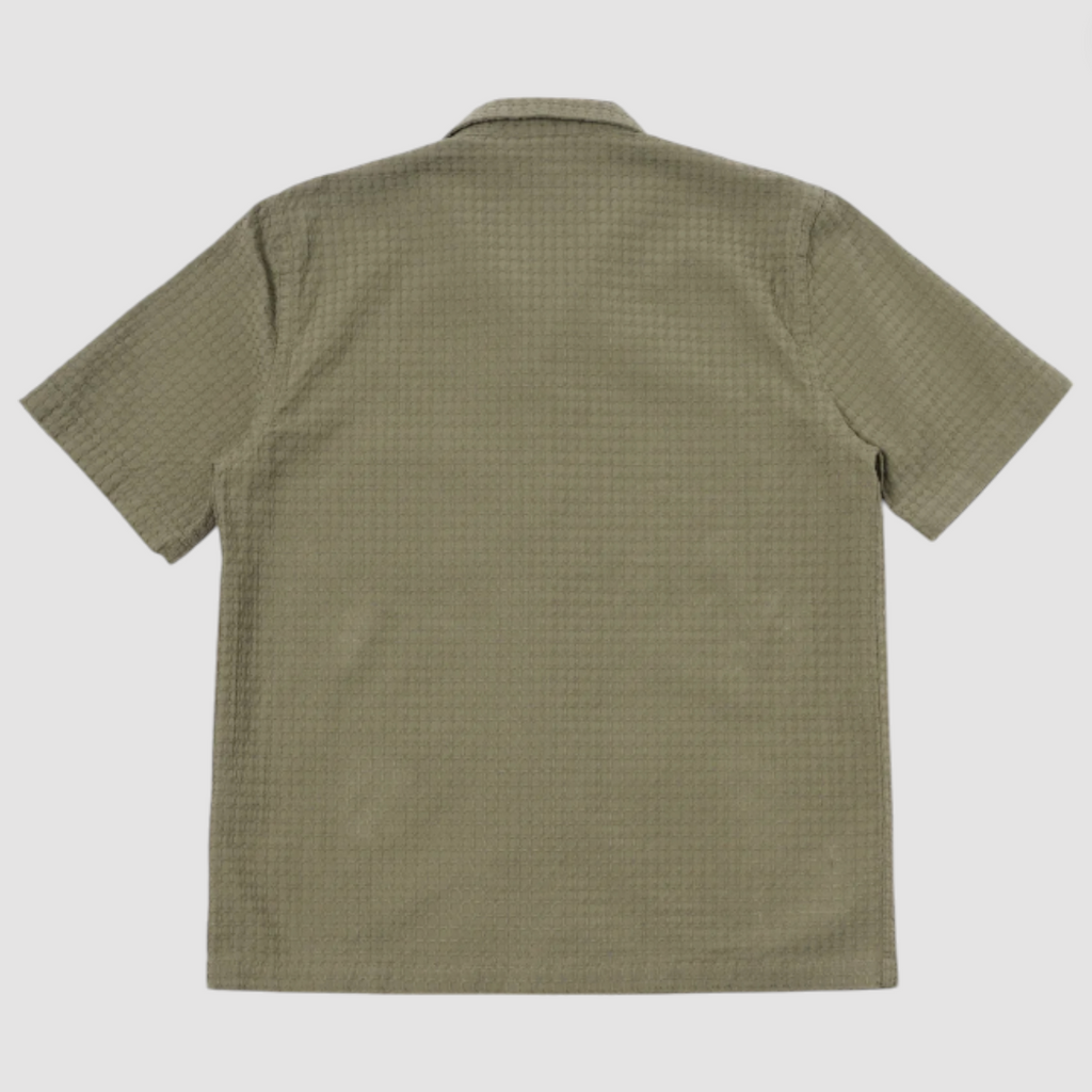 Olive short-sleeve cotton shirt with a regular fit, loop-close collar, straight hem, and a single chest patch pocket.