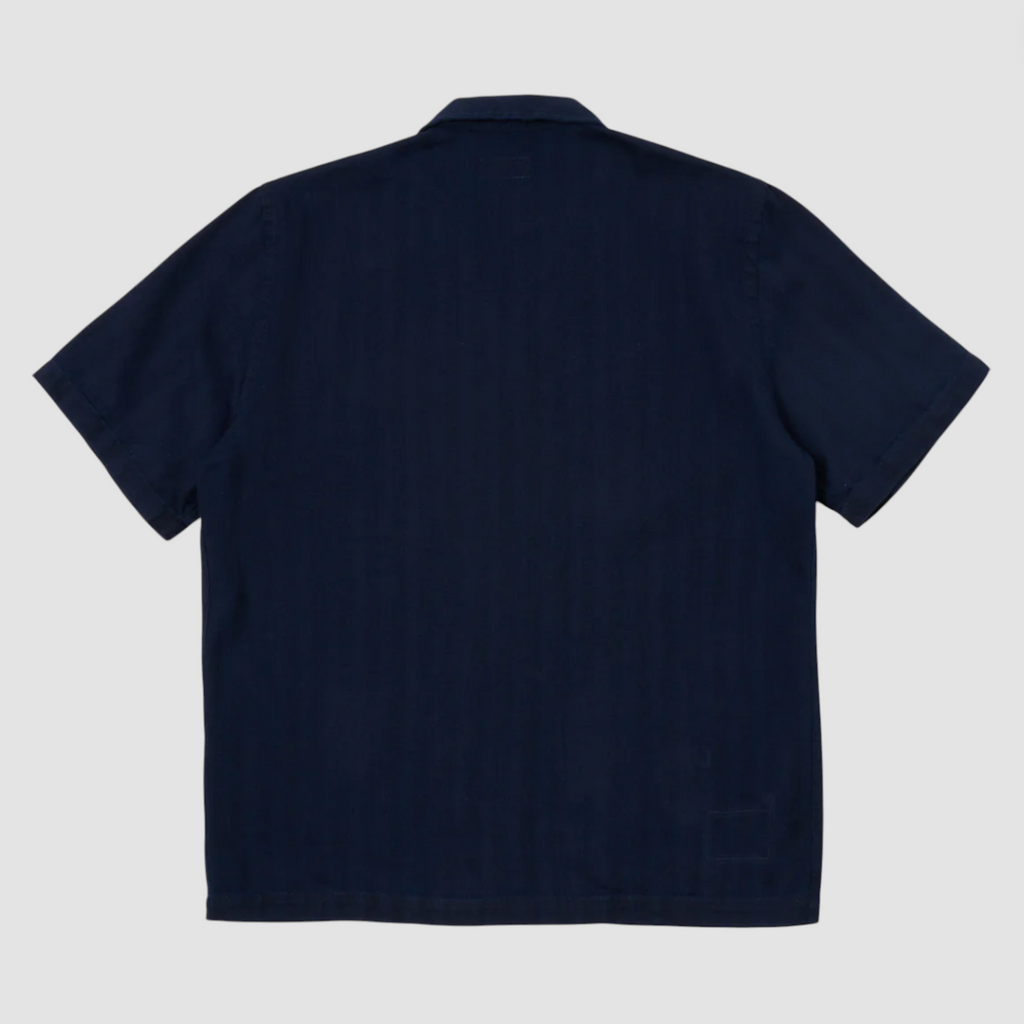 Indigo herringbone denim shirt featuring a loop-close collar, straight hem, and single chest patch pocket in a regular fit.