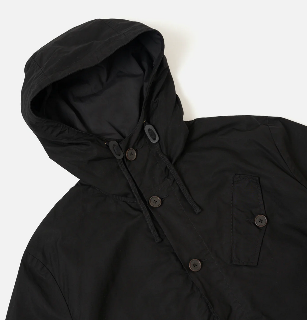 Black hooded jacket with buttons on a white background.