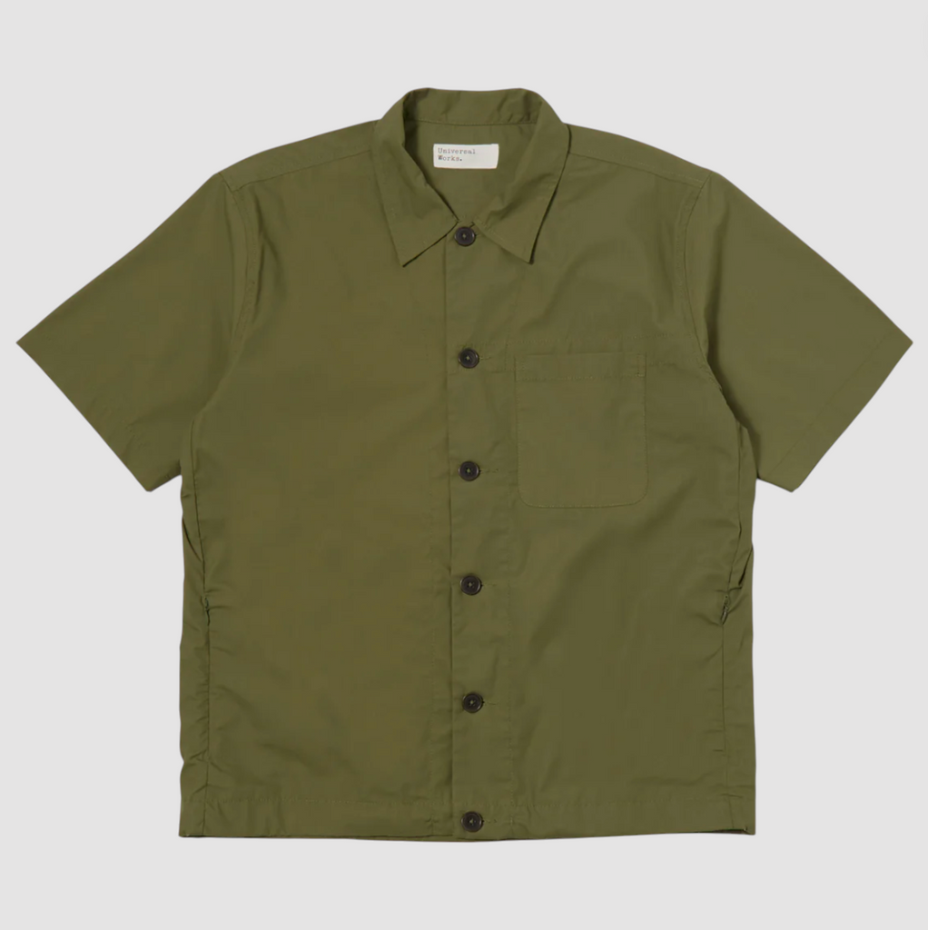 Olive short-sleeve overshirt with an elasticated drawcord hem, reinforced chest pocket, invisible side seam pockets, and a back yoke with a box pleat.