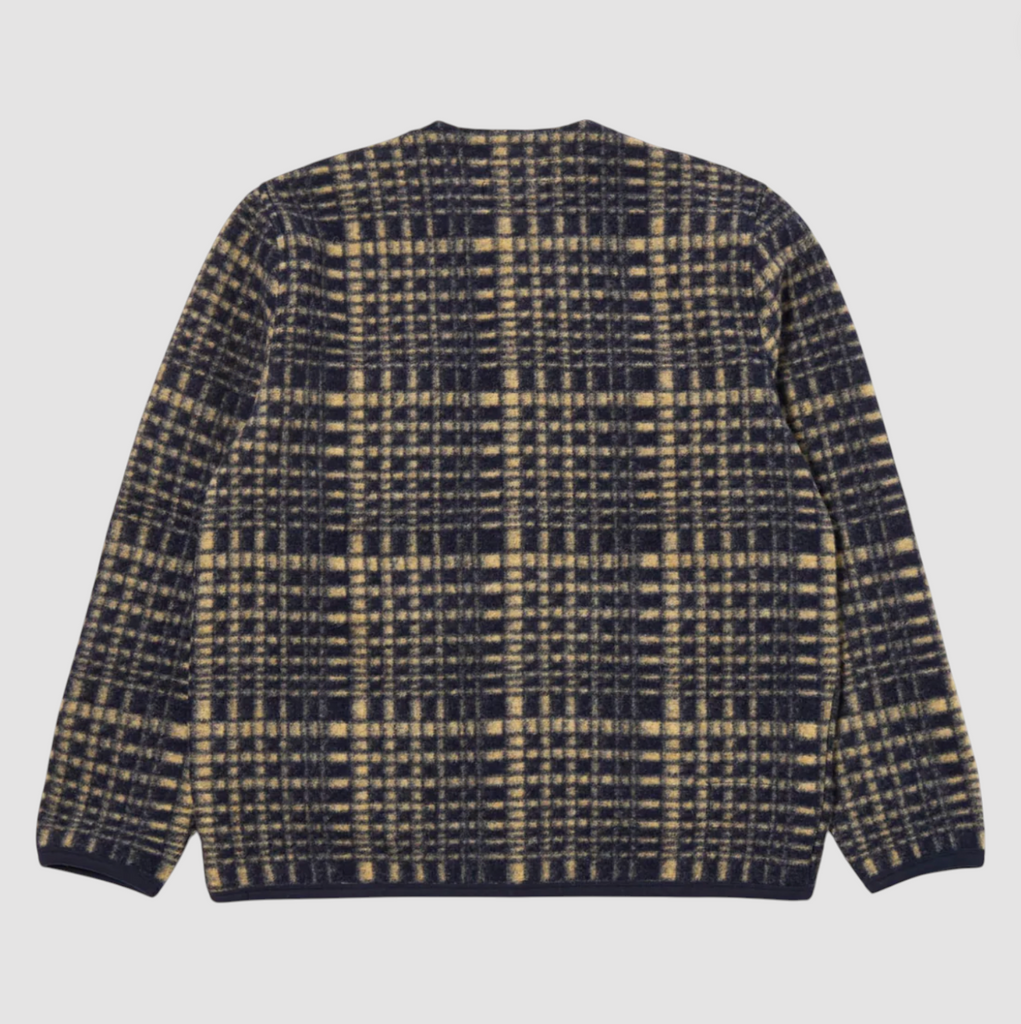Plaid patterned fleece jacket on a light gray background.