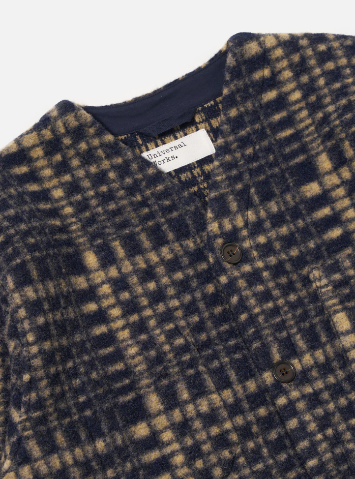 Plaid patterned fleece jacket with a visible brand label on a white background.