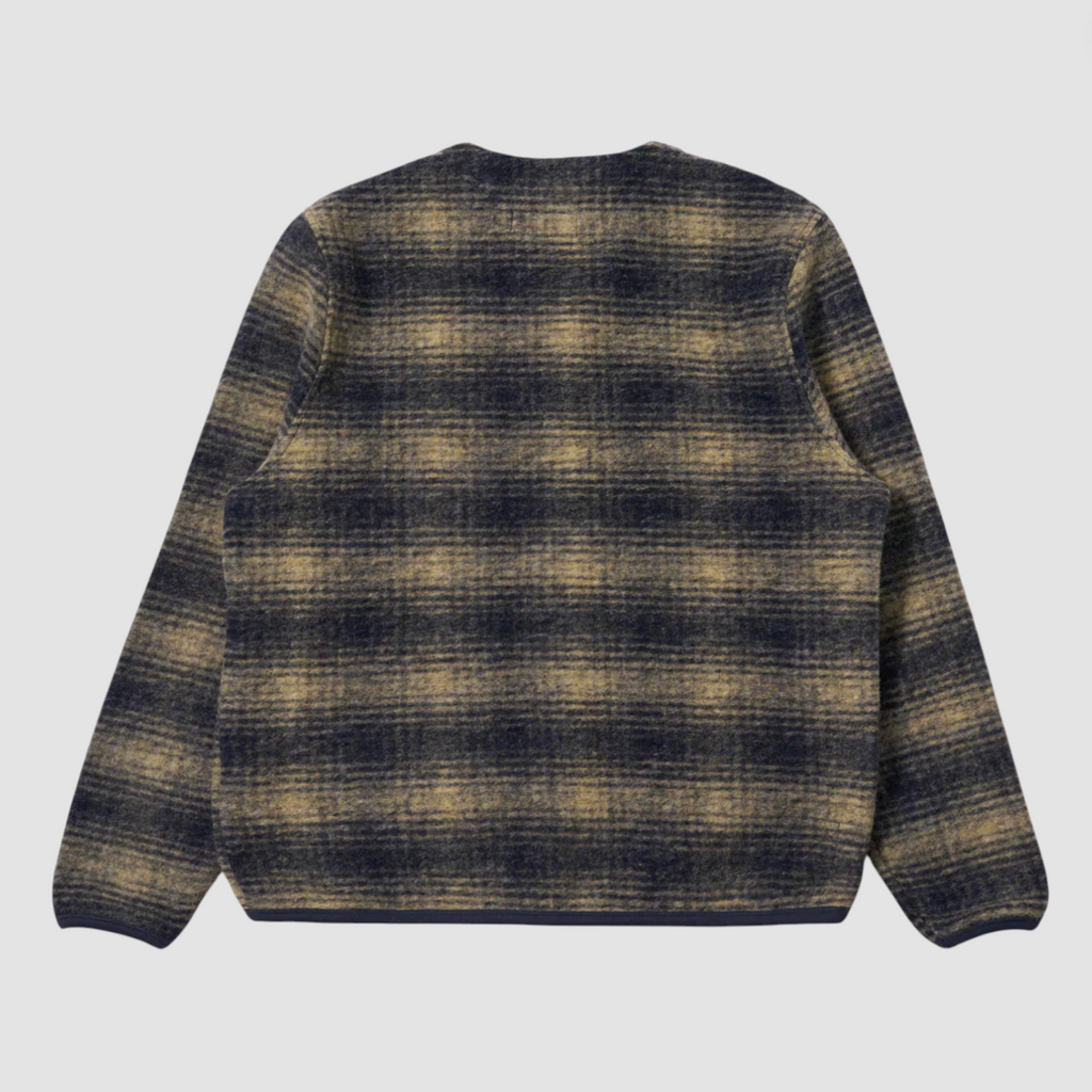 Beige and navy checkered print fleece cardigan on pale grey background. 