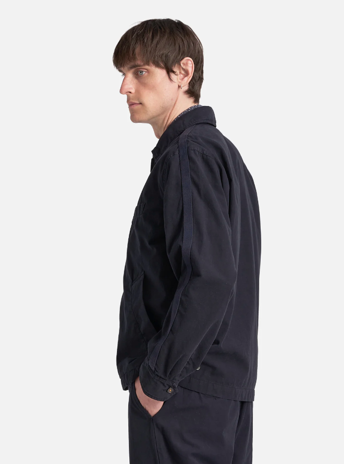 Navy cotton jacket with a double zip front, welt pockets, subtle arm stripe detail, and adjustable cuffs and waist tabs.